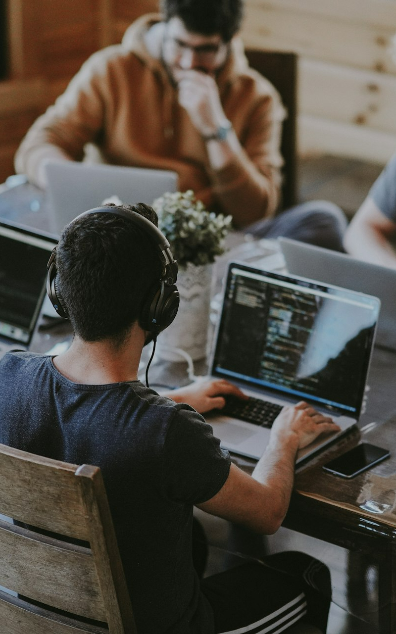 group of people using laptop computer